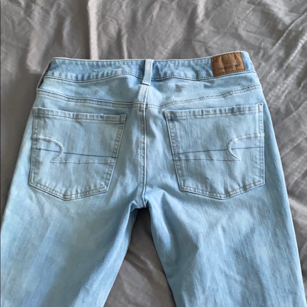 Light blue ripped jeans